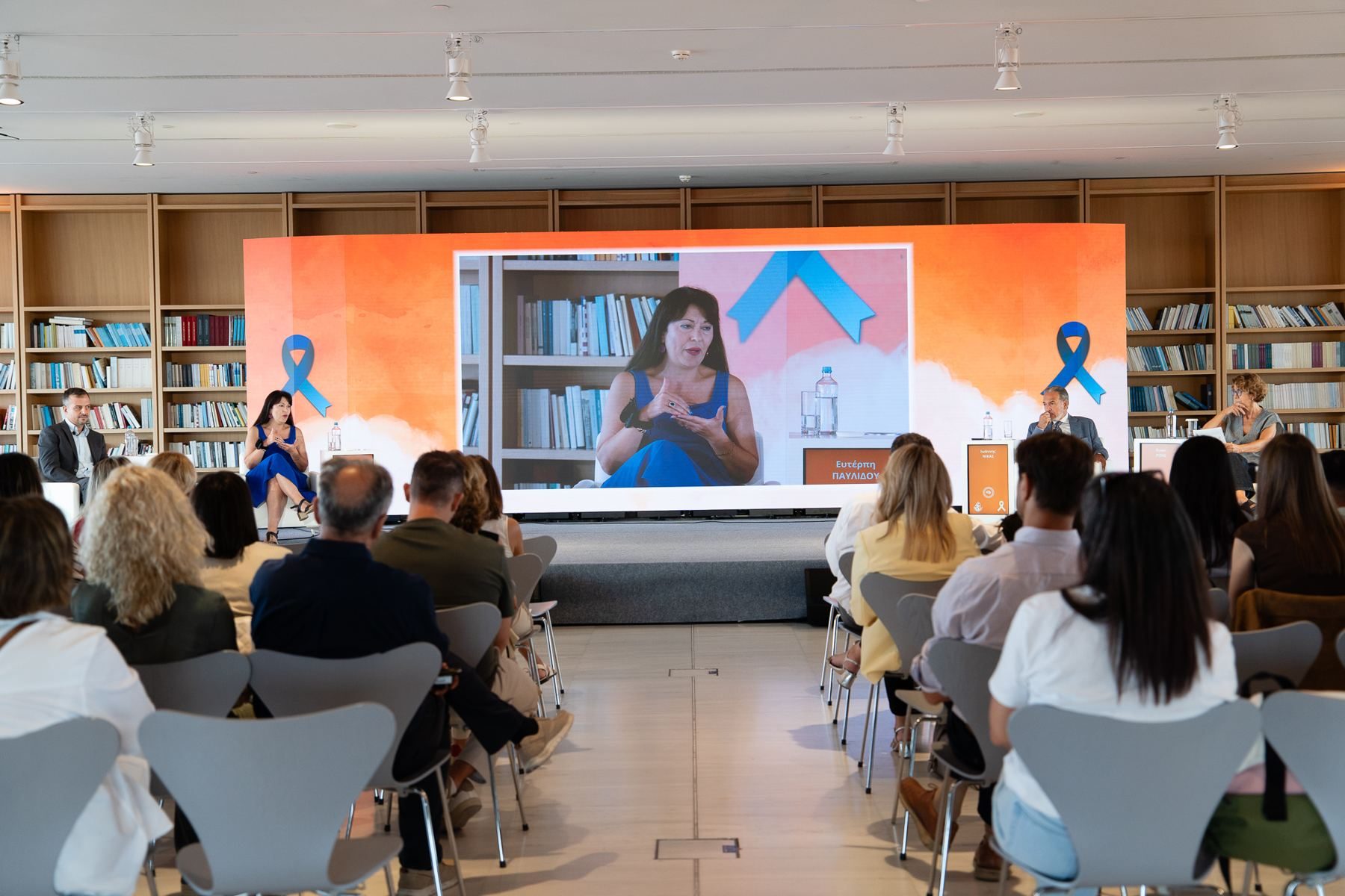 Audience and the LED wall showing a remote speaker