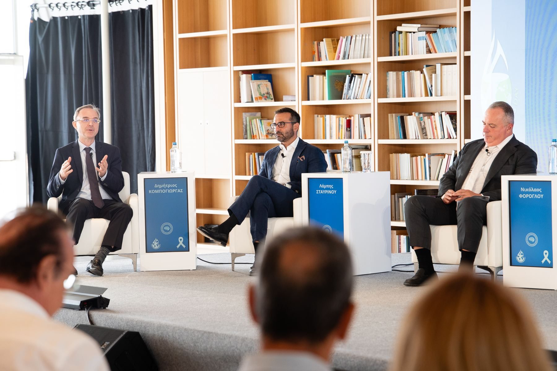 Three-member panel on stage