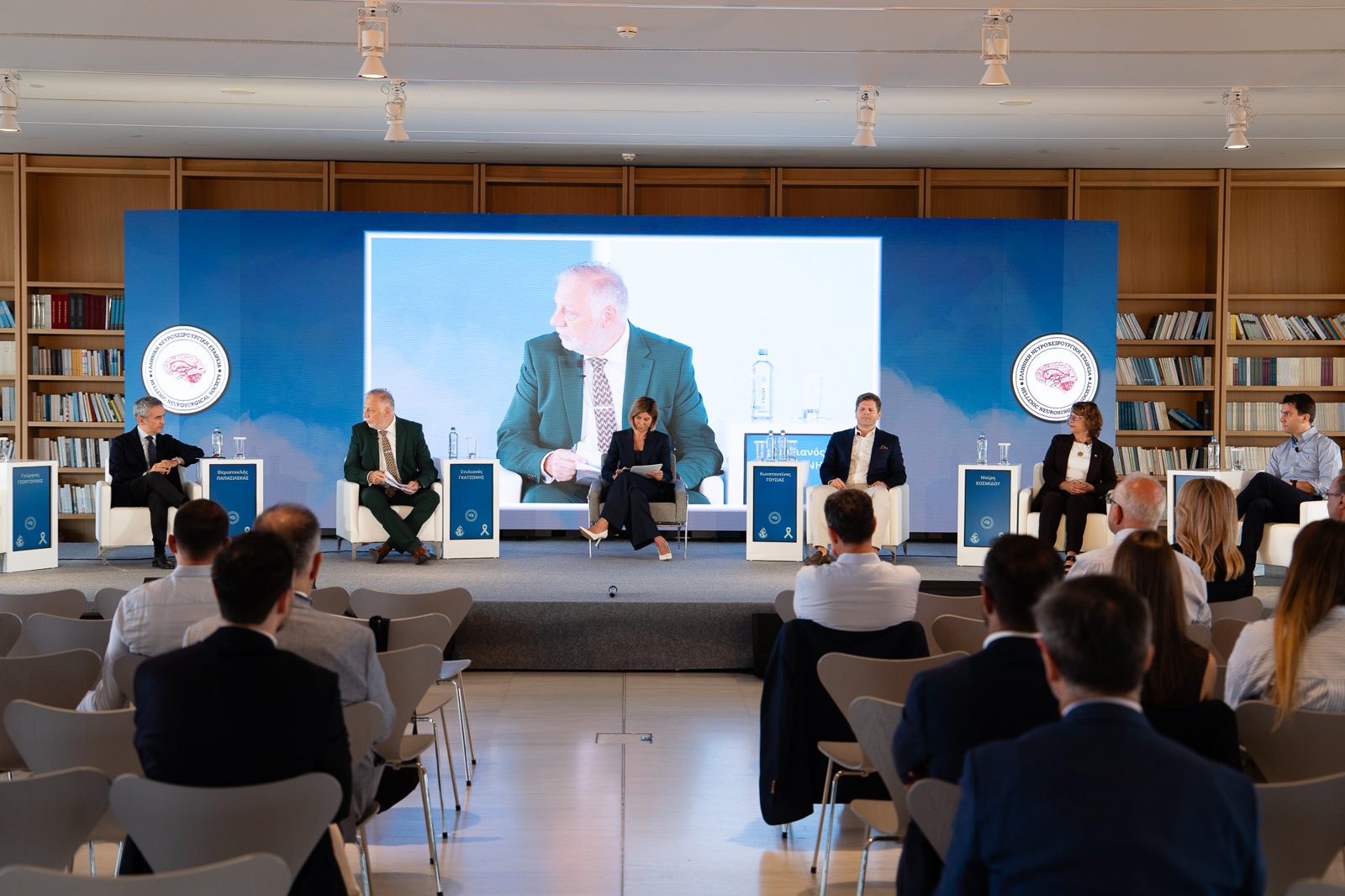 Panel on stage with the live camera feed