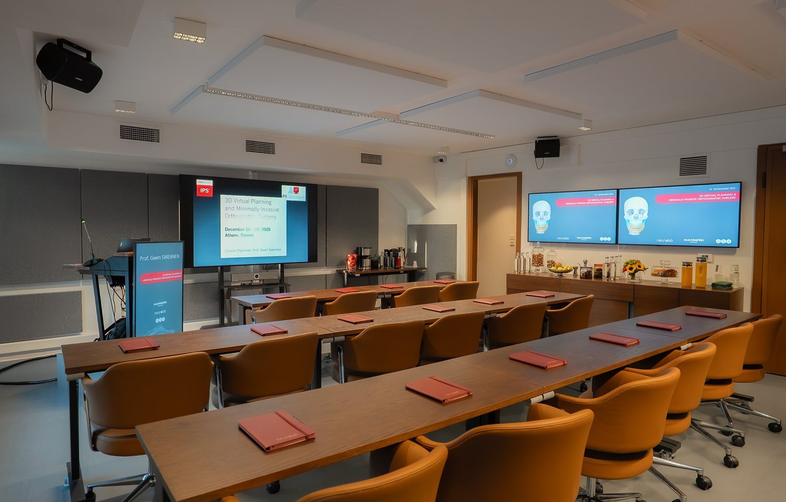 Seminar room set before the first session, with the course on every screen