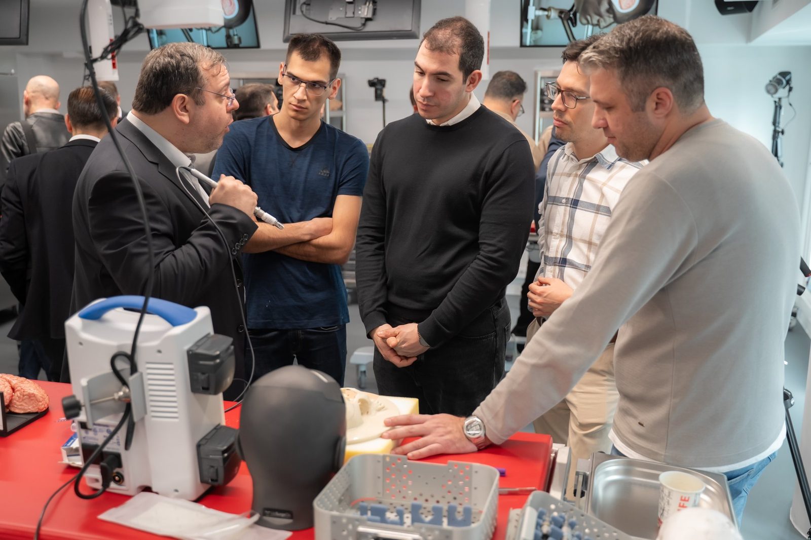 Faculty member demonstrating at a hands-on station
